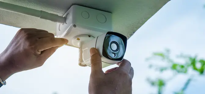 Professional outdoor security camera installation on residential home
